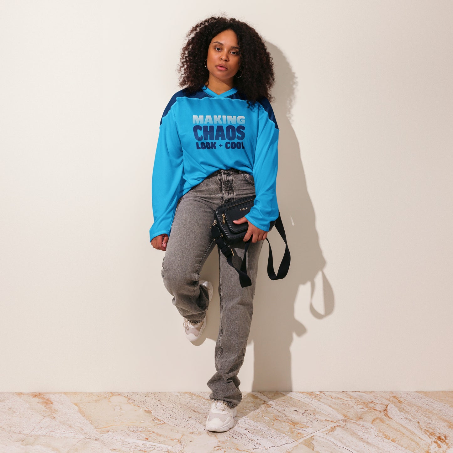 This recycled polyester hockey jersey features "MAKING CHAOS LOOK COOL." It's moisture-wicking, UPF 50+ protected, and loose-fitting for comfort and style.