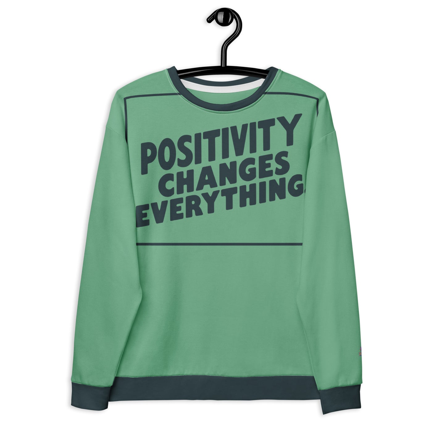 This unisex sweatshirt is a new arrival with "POSITIVITY CHANGES EVERYTHING" in a bold, dark teal tilt. Made with recycled materials for ultimate comfort.