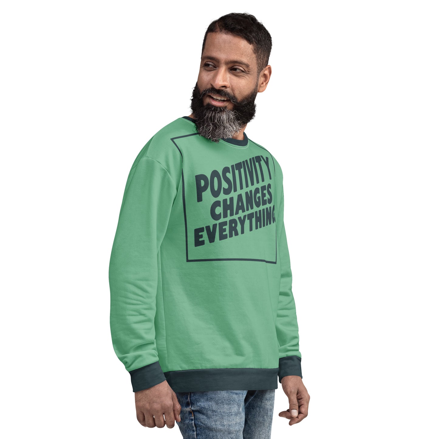 This unisex sweatshirt is a new arrival with "POSITIVITY CHANGES EVERYTHING" in a bold, dark teal tilt. Made with recycled materials for ultimate comfort.