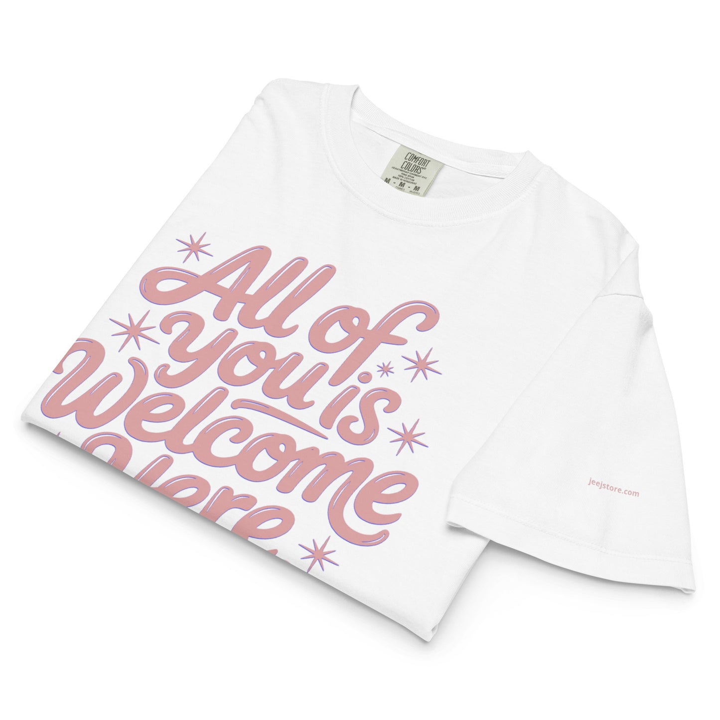 White t-shirt with pink text 'All of you is welcome here' on a white background