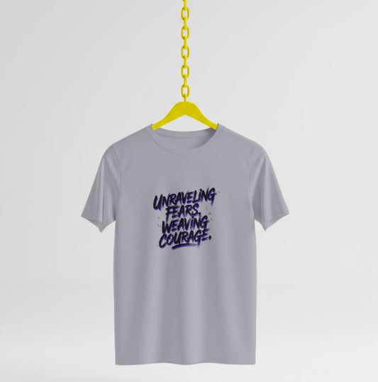 Soft, comfortable organic cotton tee with "Unraveling Fears, Weaving Courage" message. Eco-friendly, stylish, and made to empower your inner strength.