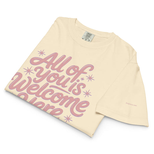 This eco-friendly, low-impact dyes tee is super soft and comfortable. Features "All of You is Welcome Here" for inclusive, sustainable style.